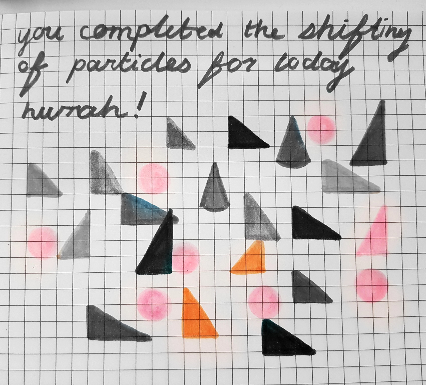 A piece of graph paper with 'You completed the shifting of particles for today. Hurrah!' hand-written at the top. Triangles and circles drawn below.